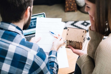 A man and woman looking at documents.